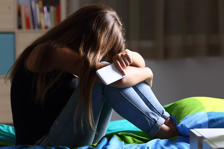 She felt anxious and hugged herself in bed