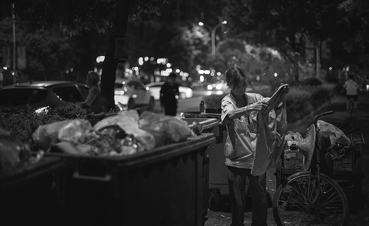 She collects waste because of her hard life.