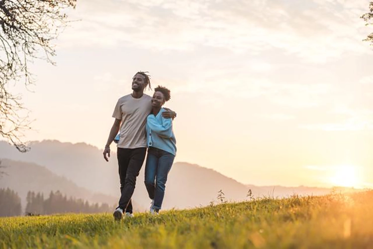 They walked forward with their backs to the sunset