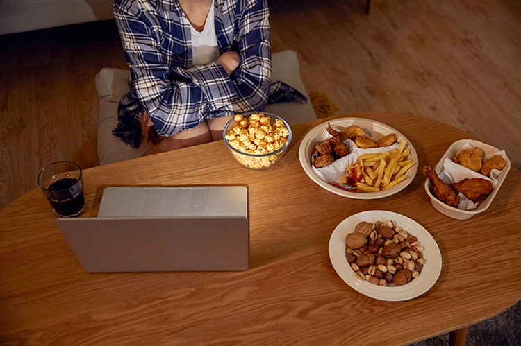 She ate fried food while watching a movie.