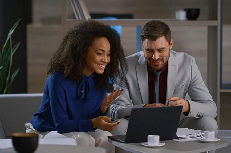 The couple is happily communicating with friends via video