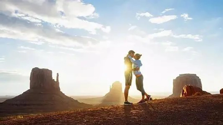 Couples hug each other in the sun