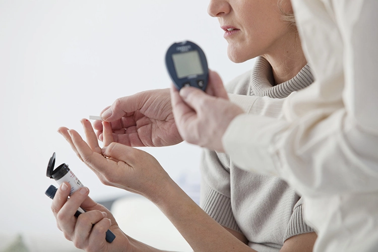 She is helping her mother test her blood sugar index.