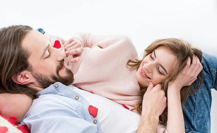 The man and the woman happily snuggled together.