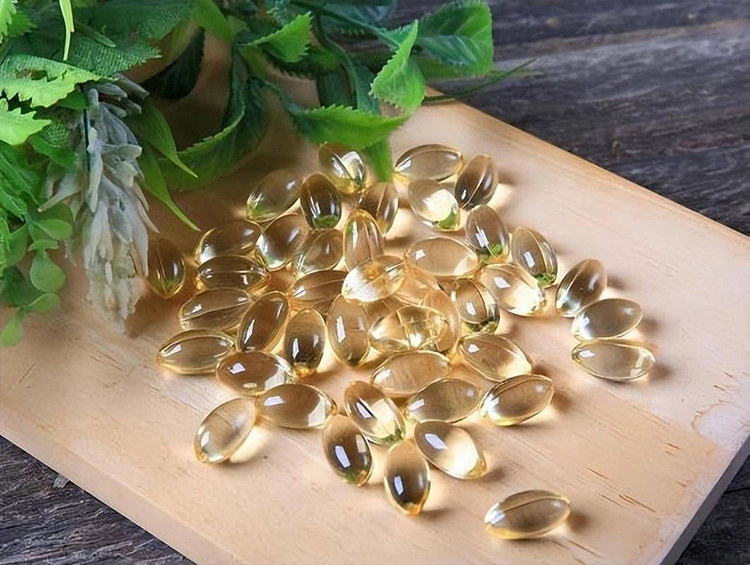 The wooden board is full of vitamin E capsules.