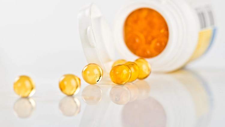 The vitamin E capsule rolled out.