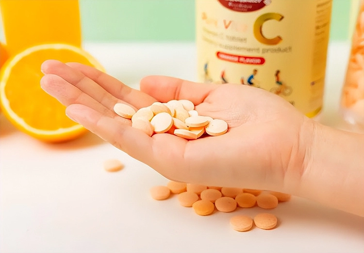 She held the vitamin E tablet in her hand.