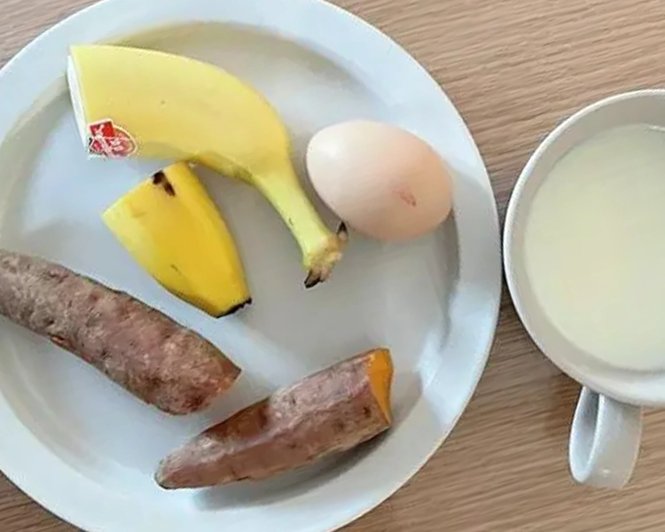 Simple breakfast: sweet potato, banana, egg, milk.