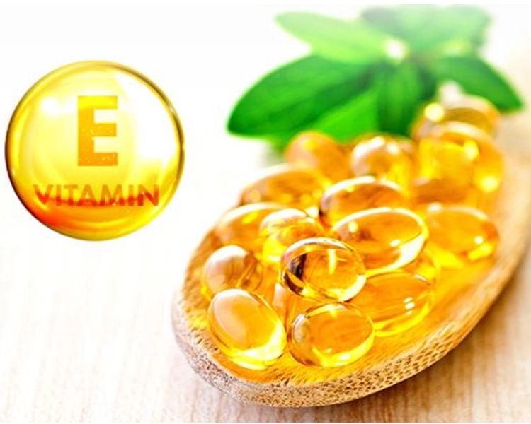 A spoonful of vitamin E capsules.